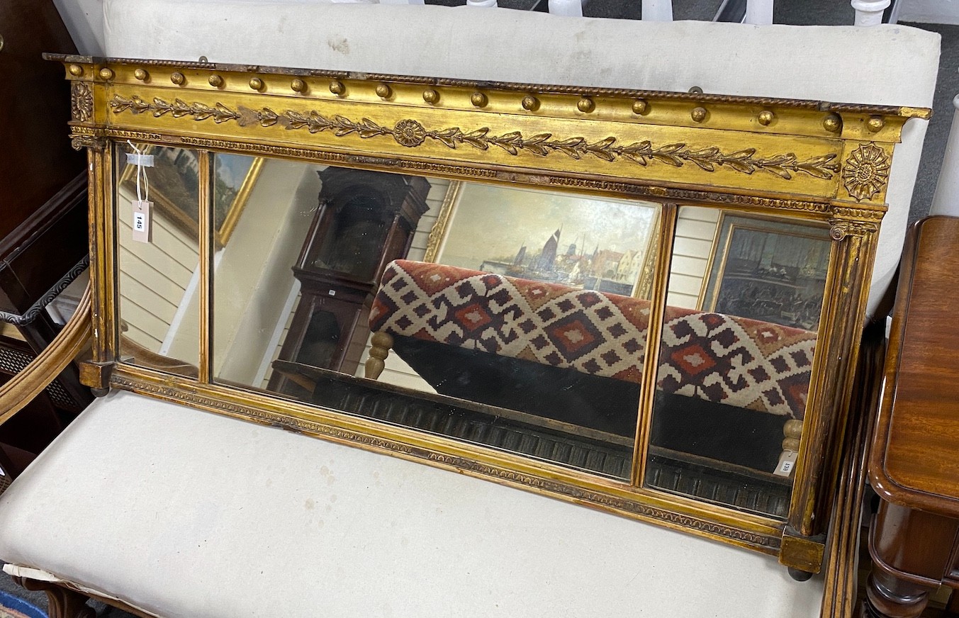 A Regency giltwood and composition triple plate overmantel mirror, width 144cm, height 60cm